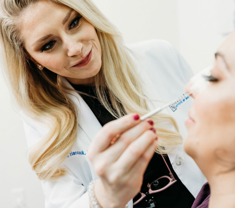 Dr. Melyssa Hancock inspect patient